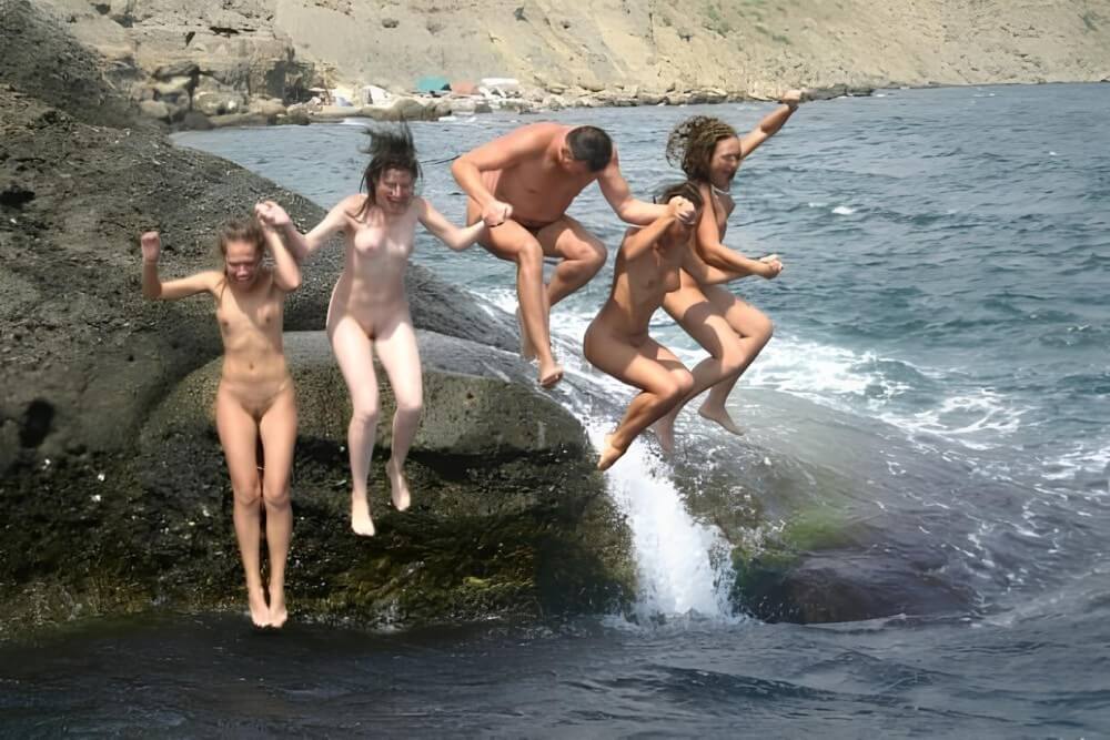 Mens and girls nudists on a beach - Nudism and naturism are a path to self-acceptance