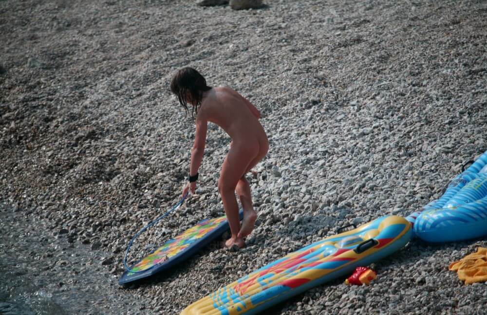 Naturist Surf Board Glides pics - Many naturists are members of Green parties or various environmental movements
